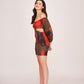 Side profile of the model in multicolour puff-sleeve mini dress highlighting side cut-out detailing and sleeve silhouette.