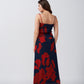 Rear view of the dress showcasing back tie and silhouette in red and navy floral print.