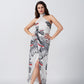 Model posing with hands on waist in grey and red floral halter neck satin dress with wrap style.