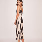 Side view of the dress highlighting the form-fitting cut, side slit, and elegant abstract pattern.