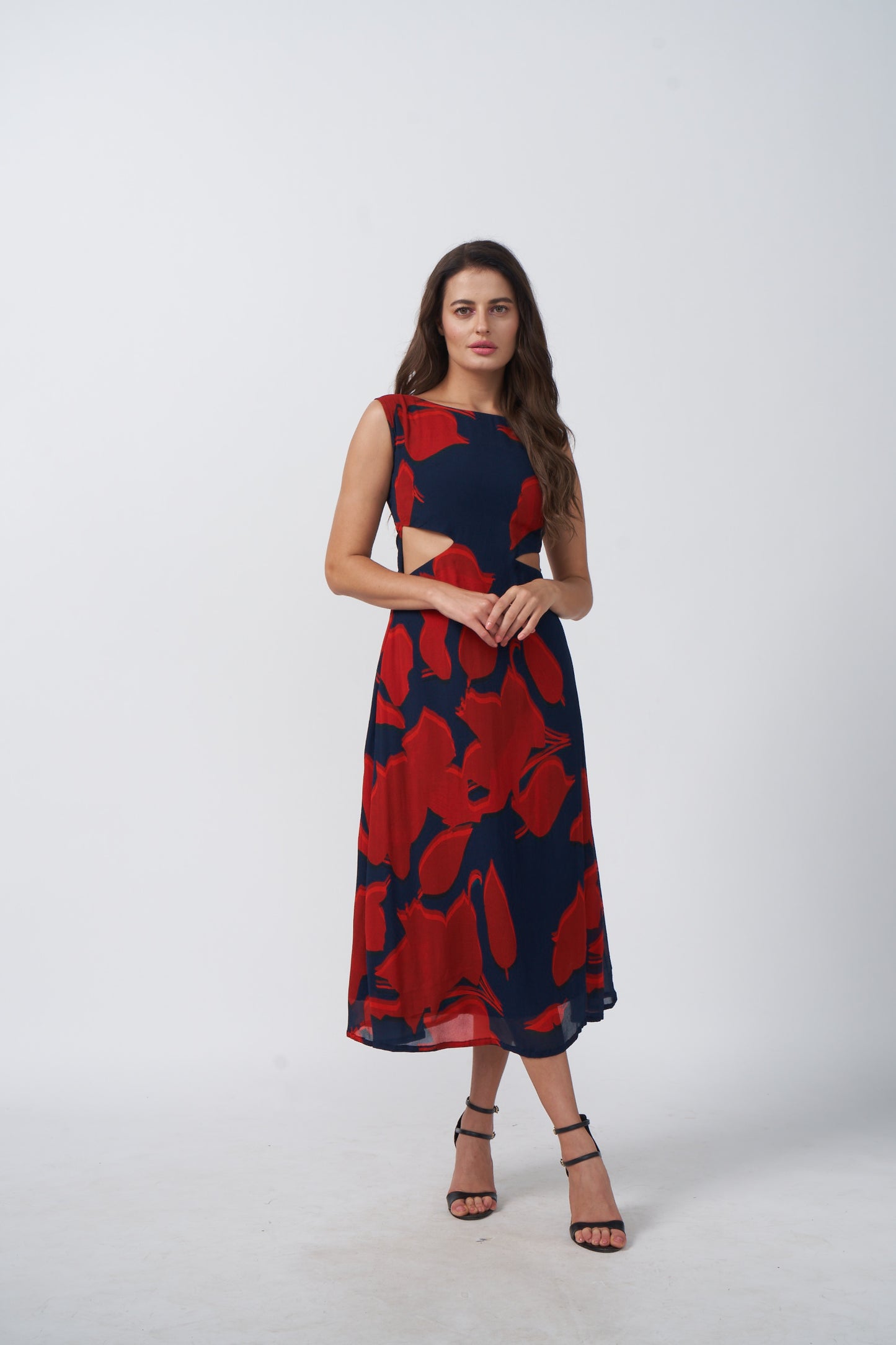 Abstract floral print midi dress in red and navy tones with a flowing drape