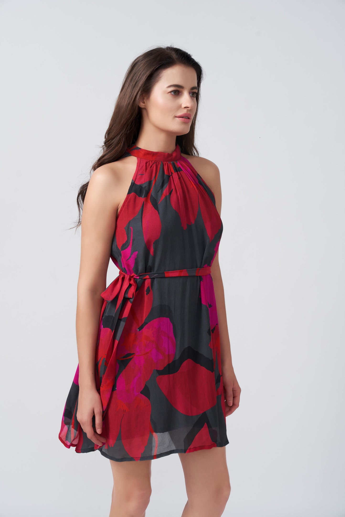 Chinon knee-length dress featuring a halter tie-back neck and soft drape