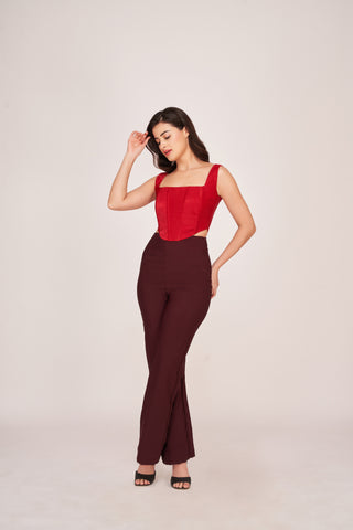 Full-length view showcasing the straight-leg cut of the burgundy pants and the curved hemline of the crop top, ideal for semi-formal occasions.