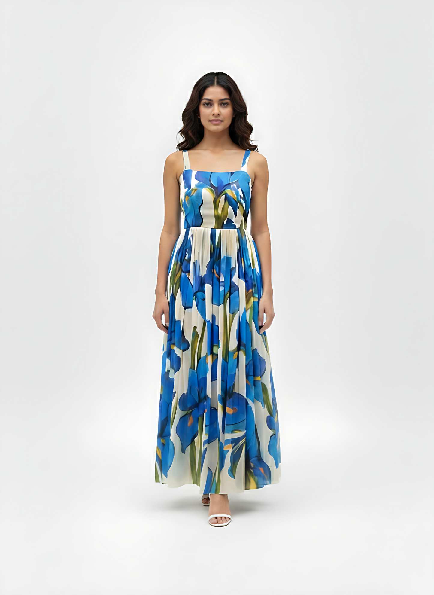 Blue floral maxi dress with a straight square neckline and slim shoulder straps, designed for refined evening occasions.