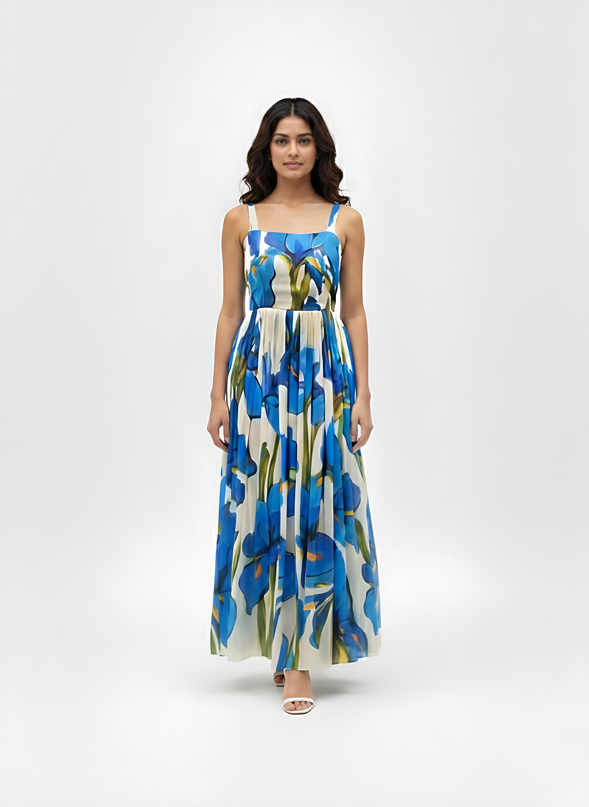 Blue floral maxi dress with a straight square neckline and slim shoulder straps, designed for refined evening occasions.