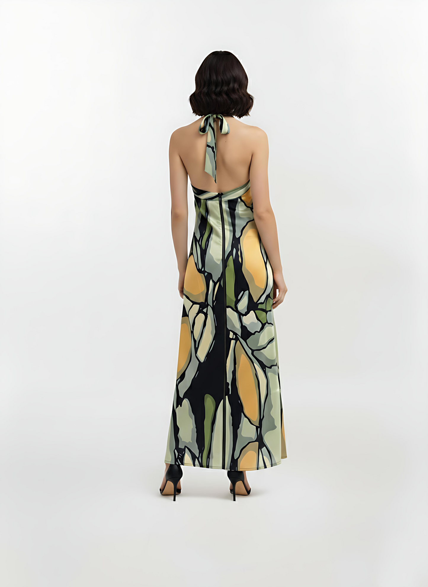 Back view of the Olive Dawn halter-neck maxi dress highlighting the open back with a slender crossover halter tie and a fluid straight-fit silhouette.