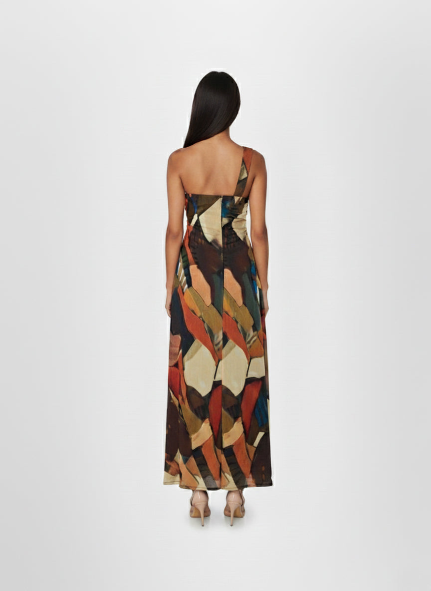 Sleeveless maxi dress with a continuous abstract mosaic print in shades of rust, ochre, and blue. 
