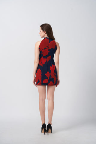 Back view of a short chinon dress with a halter neckline and fluid drape