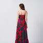 Back view of a full-length chinon dress with a flowing silhouette and shoulder straps