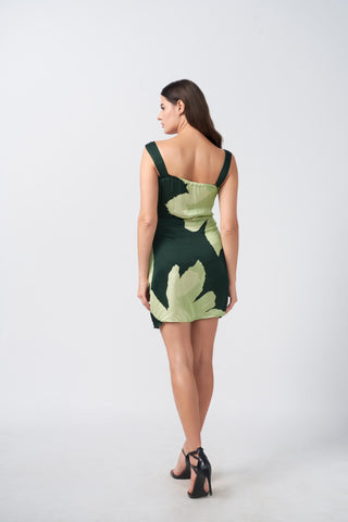 Back view of a short satin dress with shoulder straps and a fluid drape