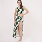 Confident front-facing pose with one hand on waist, emphasizing the round neckline and skirt print of the green co-ord.