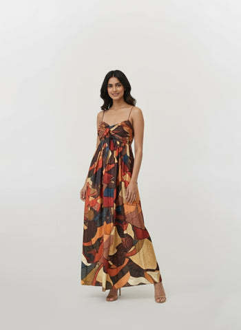 Strappy shoulder maxi dress with a bow detail and multicolored abstract print in earthy and vibrant tones