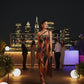 Flowing one-shoulder maxi dress with an elegant floor-length drape and earthy mosaic print