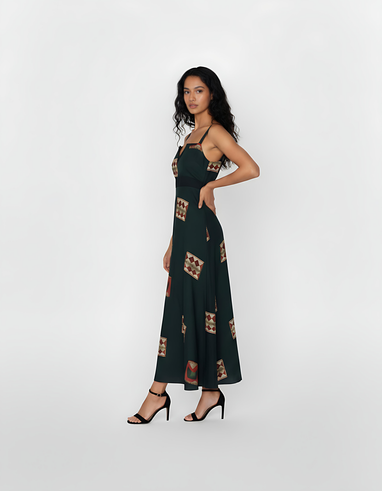 Deep green ankle-length crepe dress featuring wide shoulder straps, a notched square neckline, and earthy geometric motifs, ideal for sophisticated daytime occasions or refined evening wear.