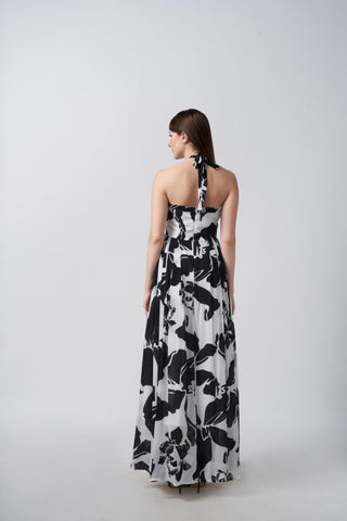 Back view of an ankle-length crepe dress with a halter tie-back neckline and smooth drape