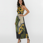 Sleeveless long dress with a deep-cut backless design. The vibrant print and breezy construction are ideal for summer evening events and elevated resort wear.