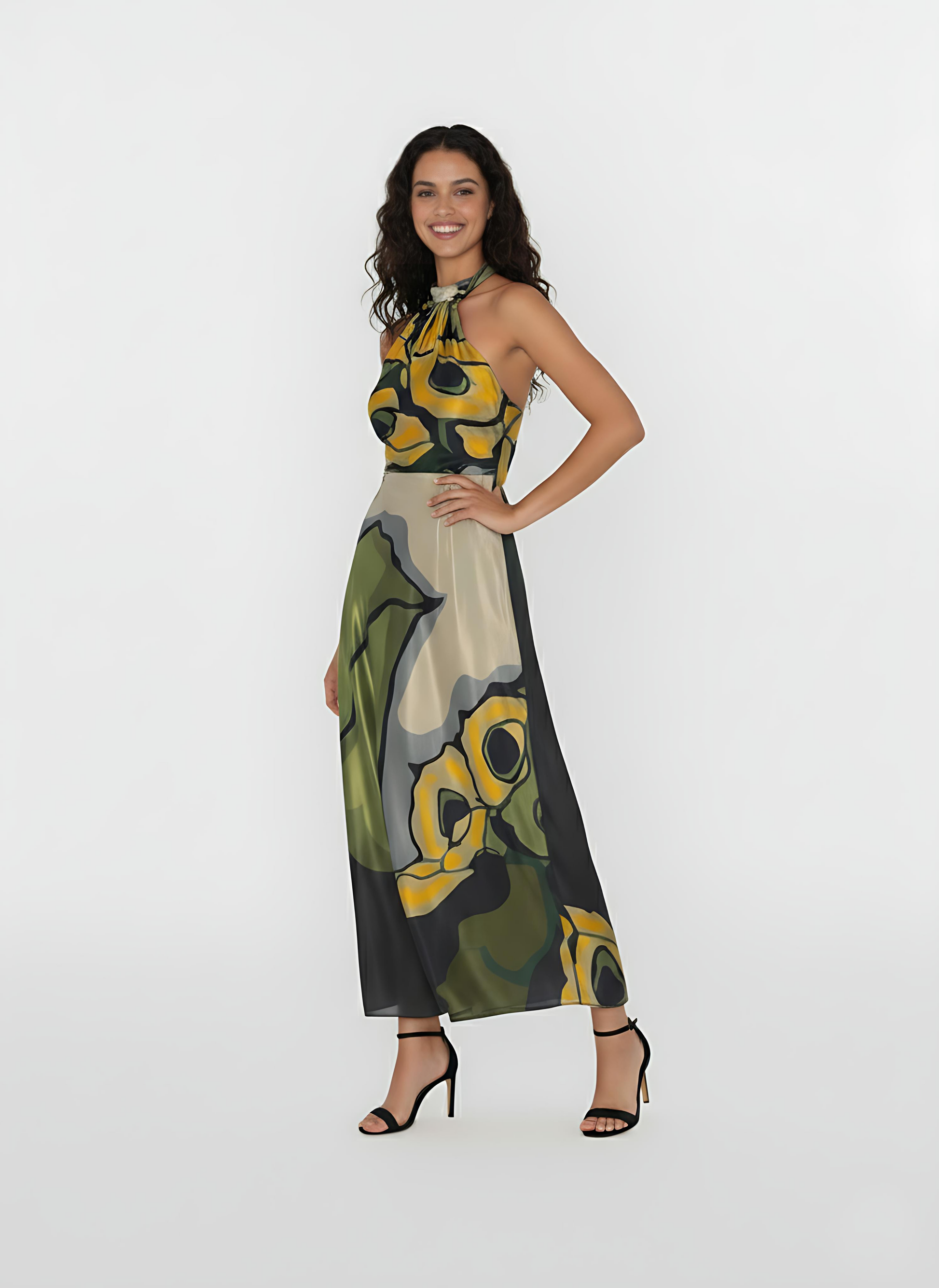 Sleeveless long dress with a deep-cut backless design. The vibrant print and breezy construction are ideal for summer evening events and elevated resort wear.