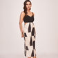 Full-length front view of the abstract printed satin midi dress with strap shoulders and chic side cut detailing.