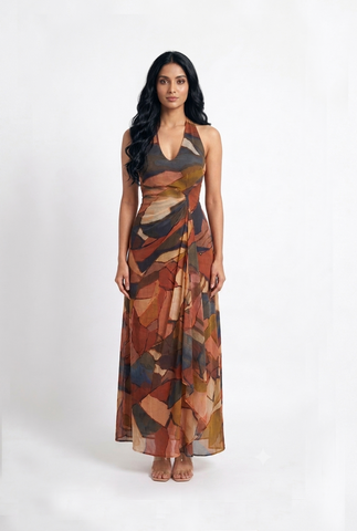 Ankle-length A-line maxi dress with a flattering ruched bodice and contemporary artistic print, ideal for special occasions and refined celebrations.