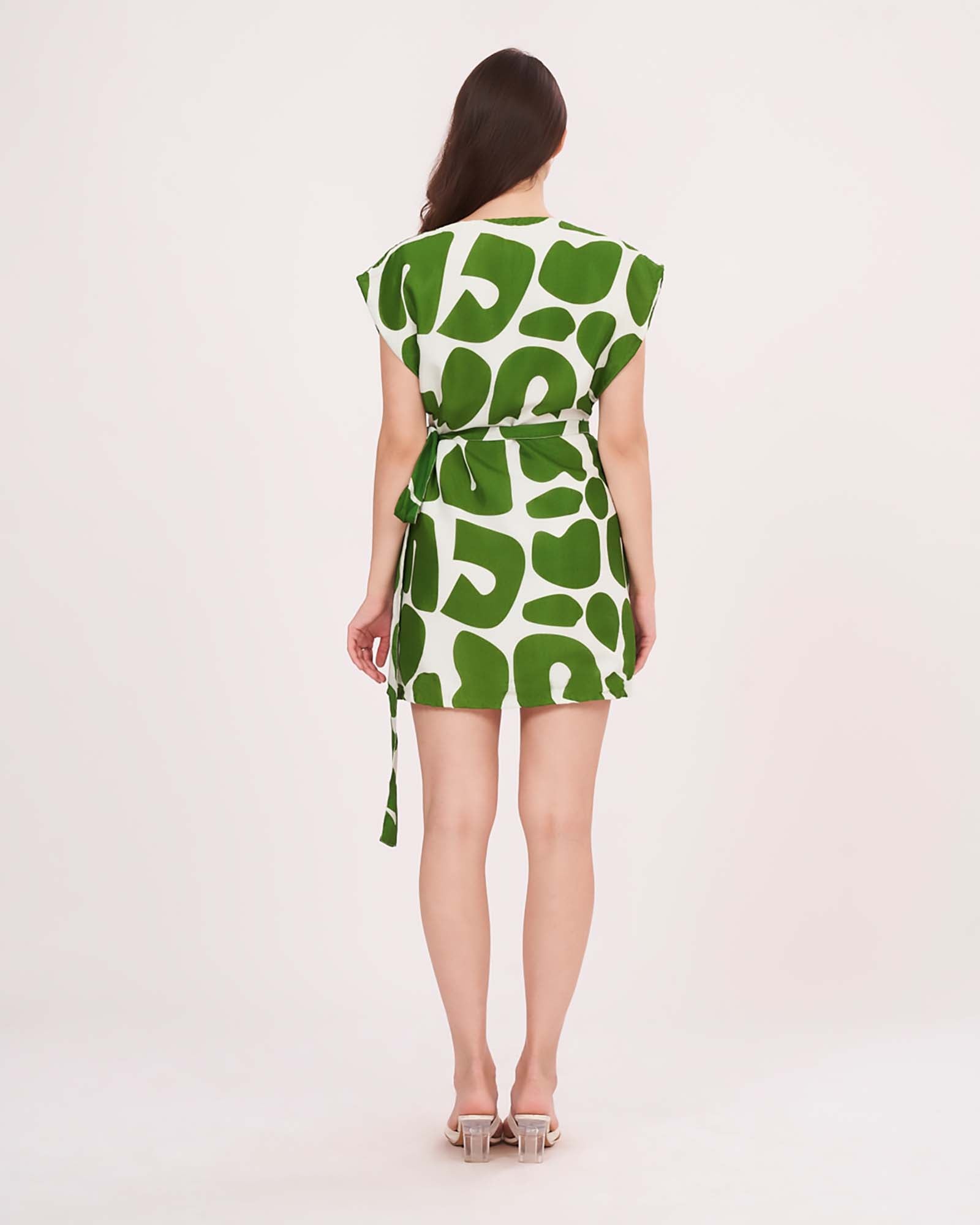 Rear view of the dress showing sleeveless back, tie-up closure, and straight hemline.