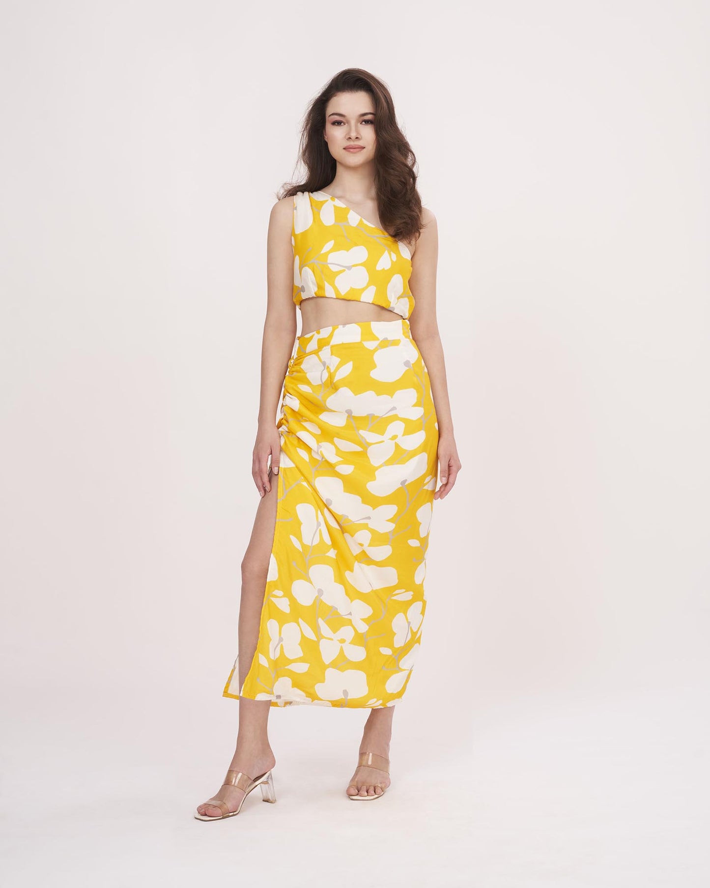 One-shoulder printed top and skirt set in muslin, ideal for vacations, sunny day events, and casual gatherings