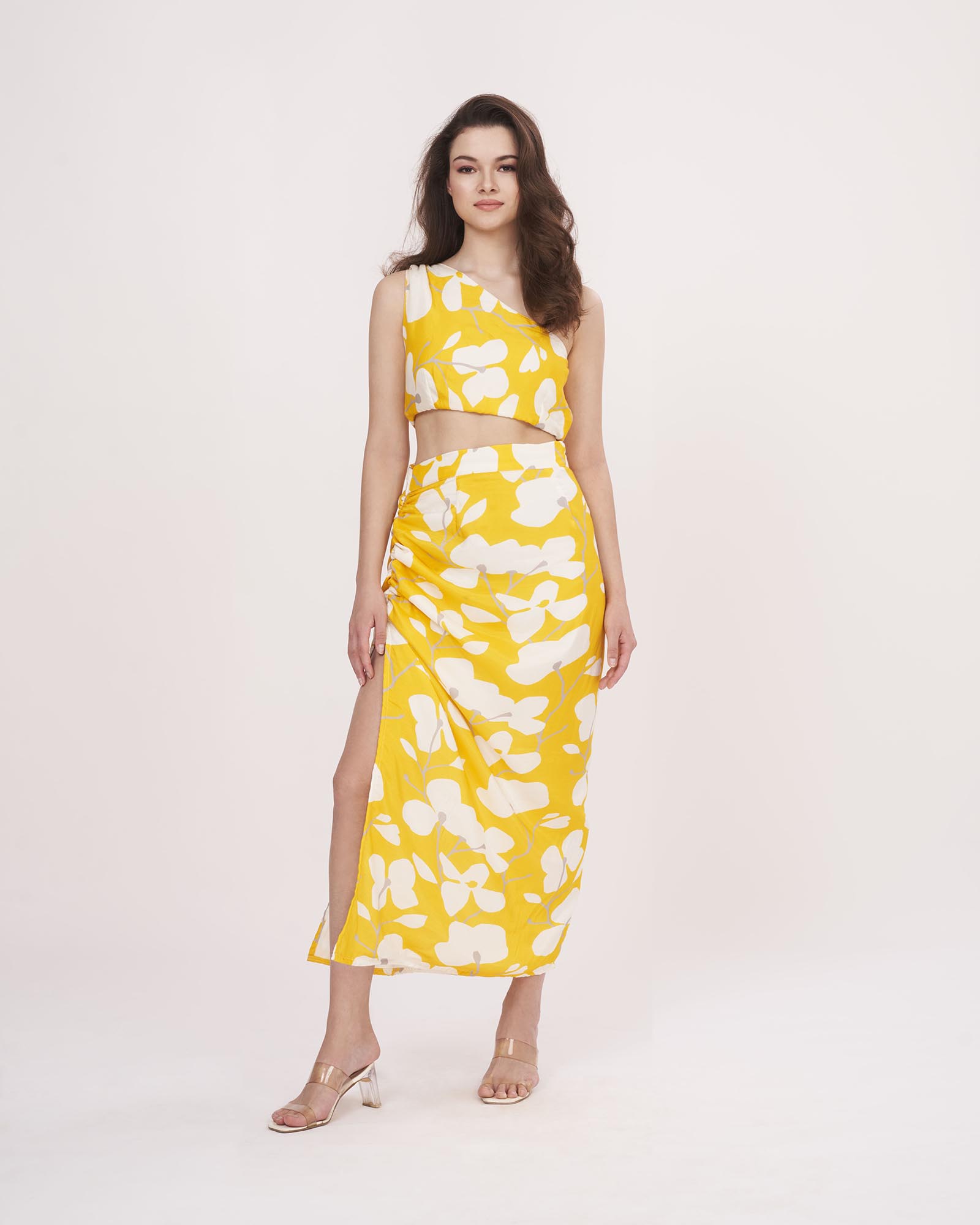 One-shoulder printed top and skirt set in muslin, ideal for vacations, sunny day events, and casual gatherings