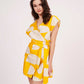 Sleeveless wrap-neck yellow cotton satin dress, ideal for warm-weather trips and casual brunches