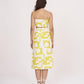 Rear view of the yellow co-ord set showing back zip closure and symmetrical strap detailing