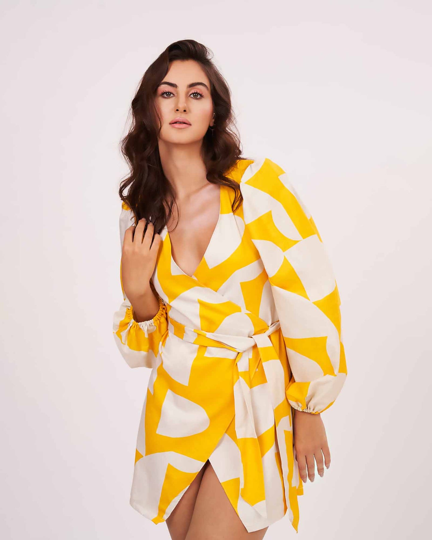 Model smiling in motion in the yellow printed short dress, capturing playful vibe and fabric flow.