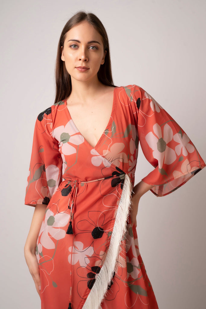 Floral wrap beach kaftan dress made from lightweight georgette fabric. Comes with a waist belt featuring tassel detailing