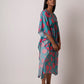 This long women's kaftan dress is crafted from breathable muslin fabric and has floral print. It's a casual resort attire