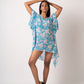 Flowy georgette beach vacation dress featuring distinctive slit sleeves and sea shell accents. Can be worn as a kimono or a mini dress