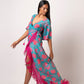 Long kaftan dress with vibrant flowers and flattering wrap style! It is made from lightweight muslin fabric