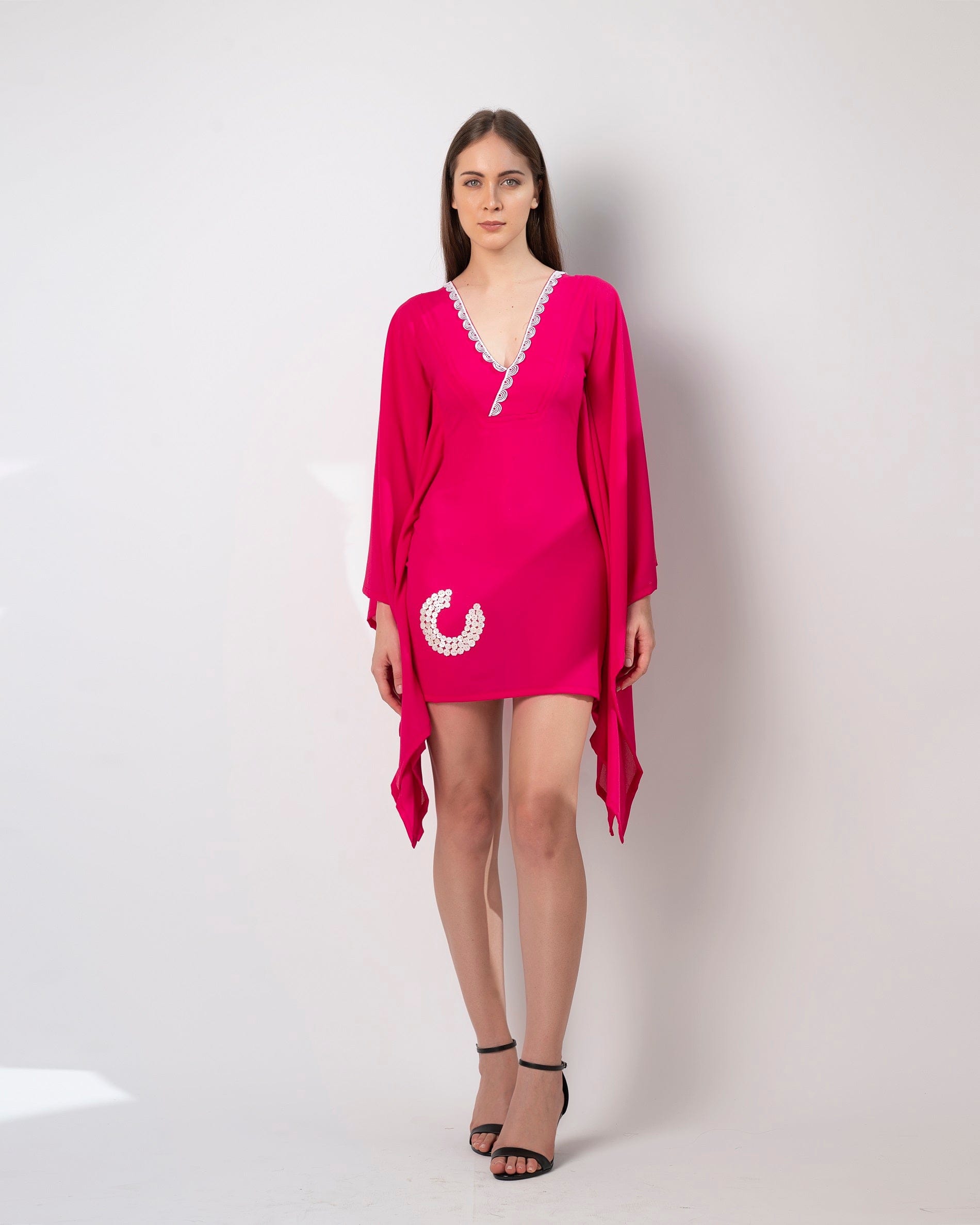 This flowy pink short kaftan dress is made of soft georgette lycra and is perfect for any occasion, whether it's a casual day out or resort party wear.