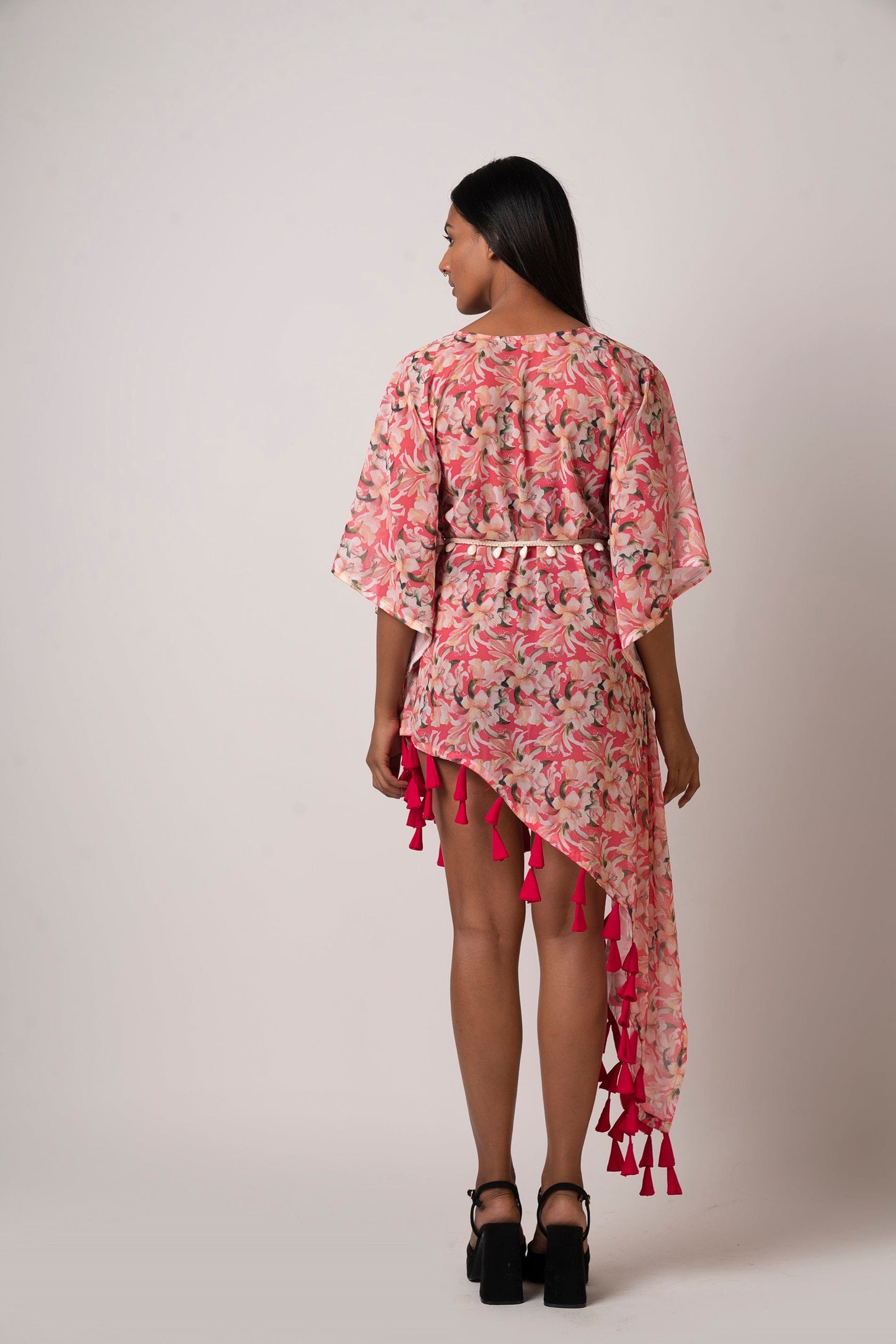 This red floral beach dress is perfect as summer beach wear for women.  Its lightweight fabric, flowy silhouette, and kimono-style sleeves make it comfortable to wear all day. The sea shell belt cinches at the waist, giving you a perfectly flattering look. 