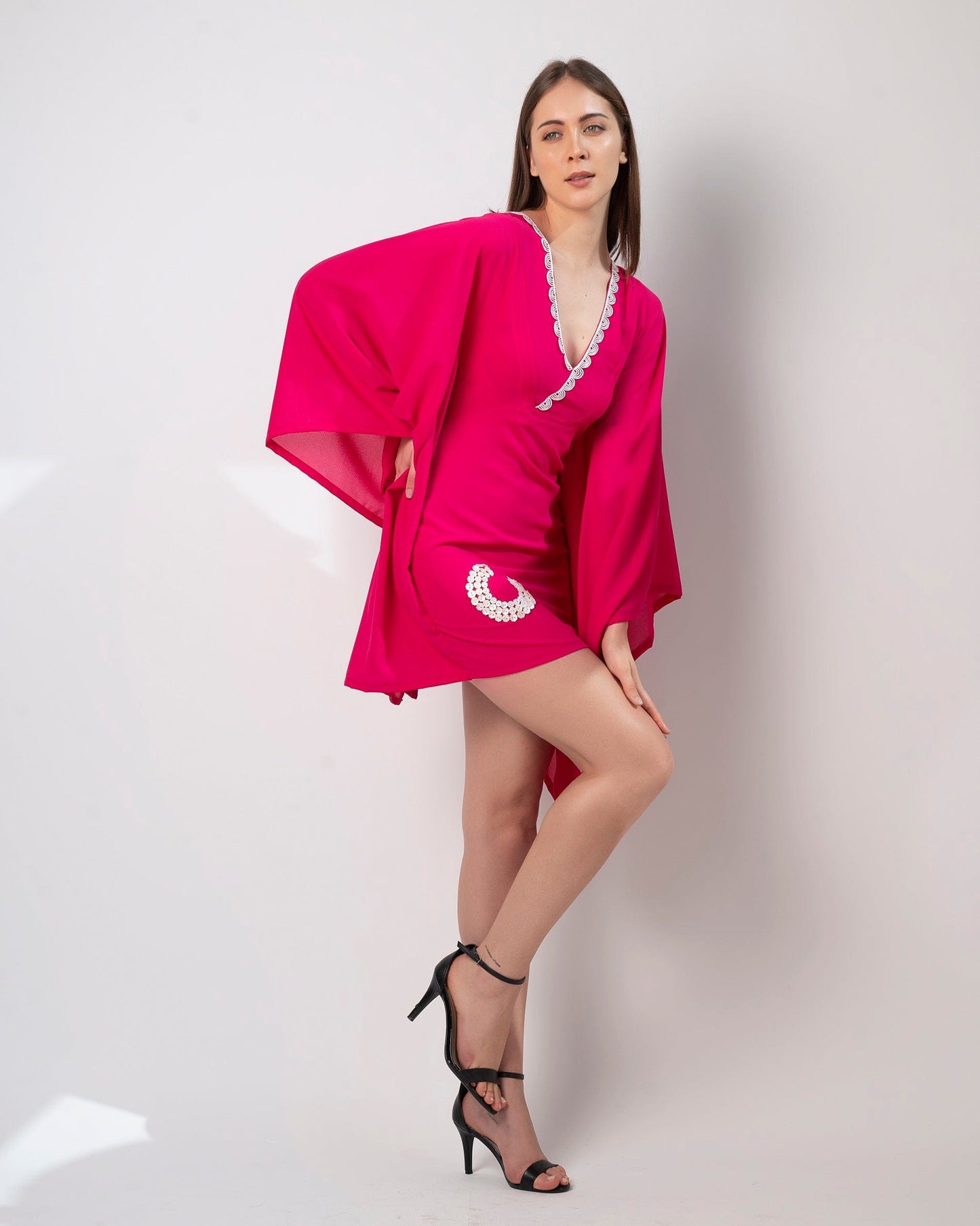 This flowy pink short kaftan dress is made of soft georgette lycra and is perfect for any occasion, whether it's a casual day out or resort party wear.