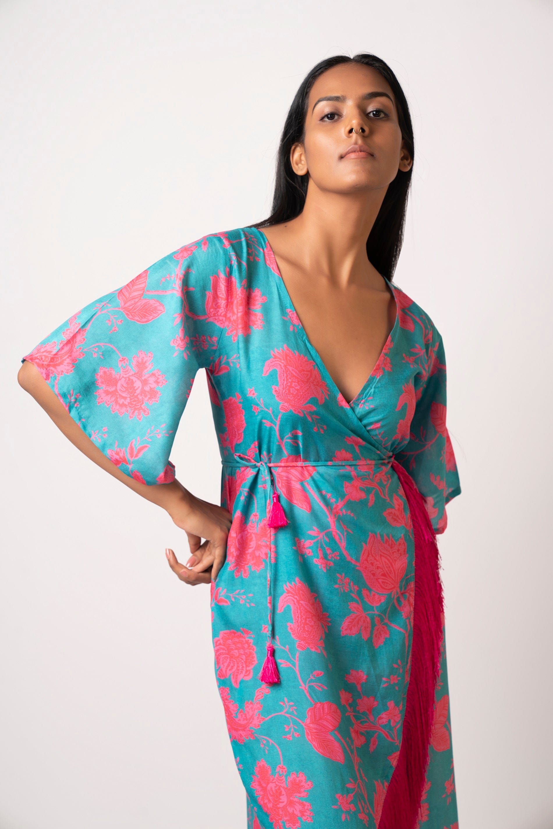 Long kaftan dress with vibrant flowers and flattering wrap style! It is made from lightweight muslin fabric