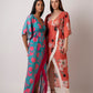 Long kaftan dress with vibrant flowers and flattering wrap style! It is made from lightweight muslin fabric