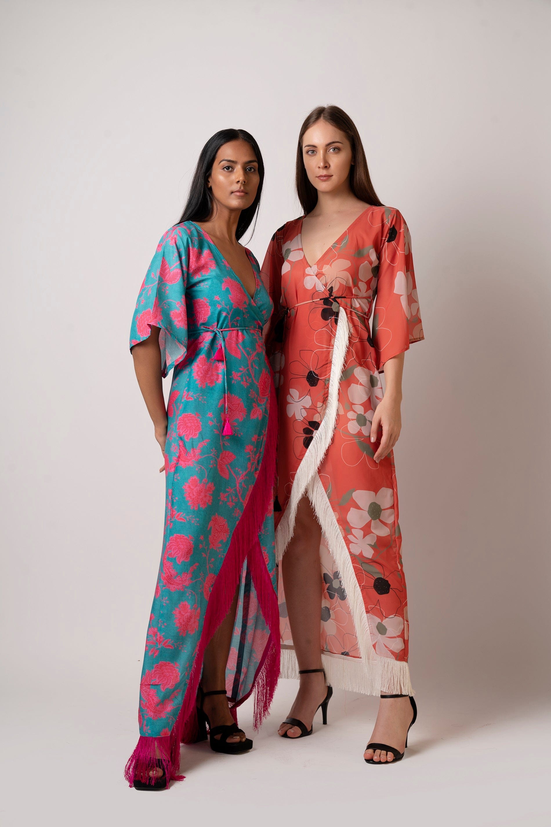 Long kaftan dress with vibrant flowers and flattering wrap style! It is made from lightweight muslin fabric