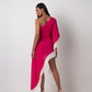 Rear view of the pink one-shoulder kaftan dress showing shell-embellished fringe details and asymmetrical hem