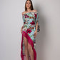 Full-length front pose showing detachable seashell belt and asymmetrical hemline on the flowy blue printed rayon dress.