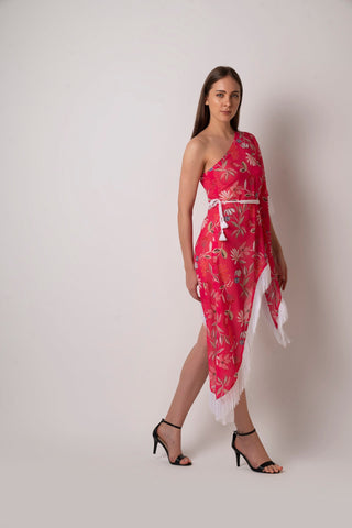 Full front-facing view of model in pink one-shoulder tassel dress with cinched waist and statement hemline.