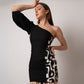 Black printed one-shoulder cotton mini dress with shell accents, ideal for beach vacations and seaside strolls