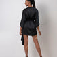 Rear view of black kimono mini dress showcasing back silhouette and flowy kimono sleeves.