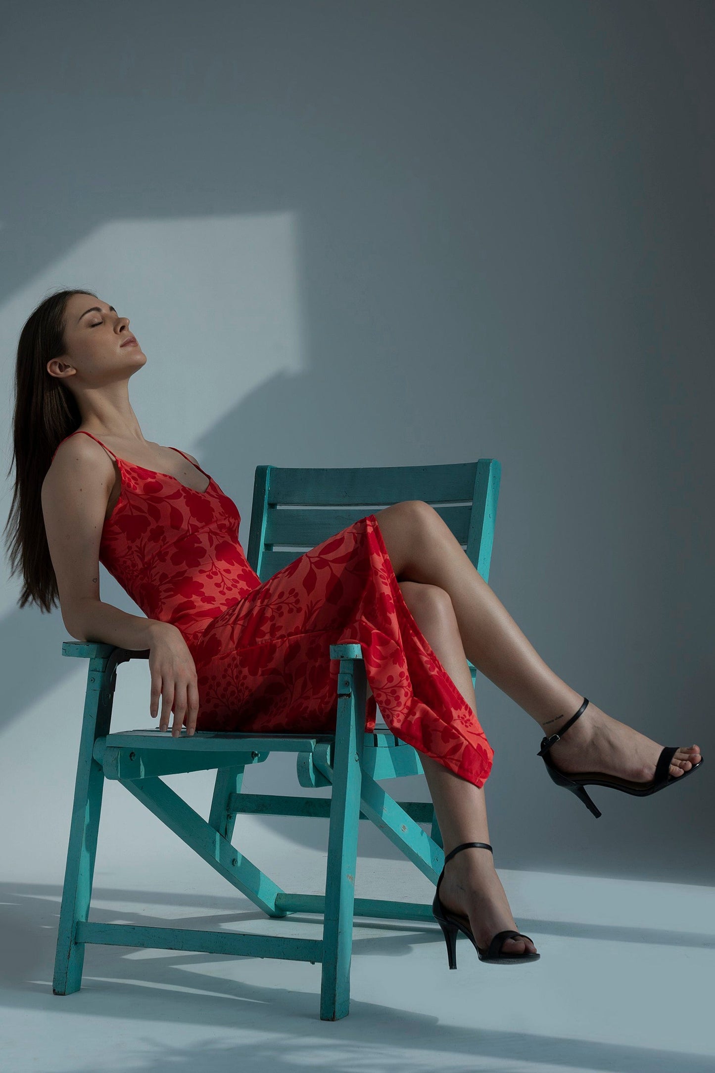 Red floral printed muslin dress with a high-low hem, ideal for summer vacations and daytime outings