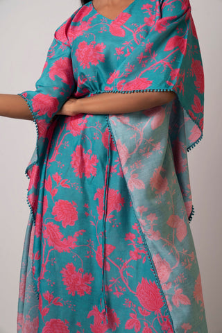 Mid-close-up side view of kaftan dress, showing sleeve volume, front tie-up bow, and lace-trimmed hem.