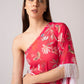 Zoomed-in angle of model in pink printed georgette dress looking over shoulder, showcasing neckline and sleeve.