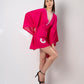 Pink kaftan knee-length dress in a dynamic walking pose showing flowy silhouette and side movement.