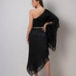 Rear view of black one-shoulder kaftan dress showcasing back drape, fringe hem, and tie-up sea shell belt.