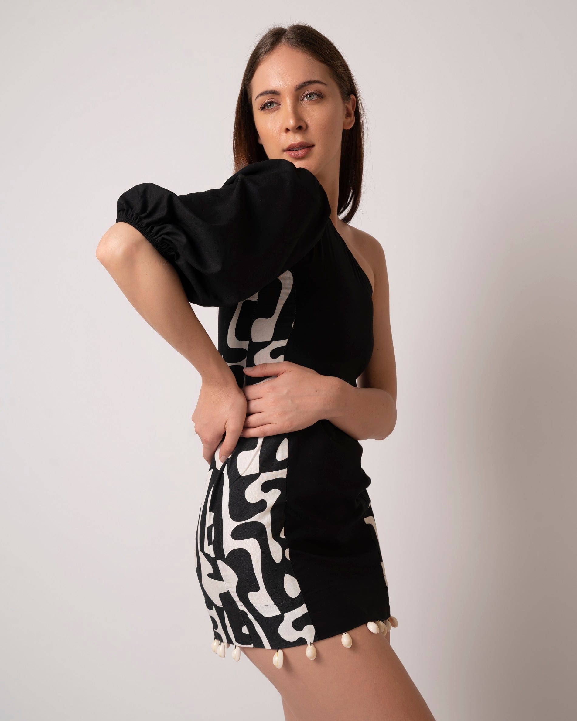 Black printed cotton mini dress with a one-shoulder neckline and asymmetrical design